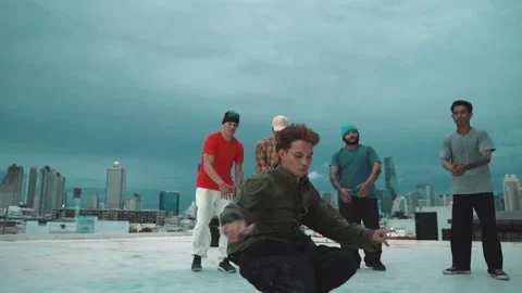 Hipster doing freeze pose while moving footstep to music at rooftop. hiphop. Stock Footage 273737497