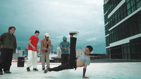 Hipster doing freeze pose while moving footstep to music at rooftop. hiphop. Stock Footage 277032101