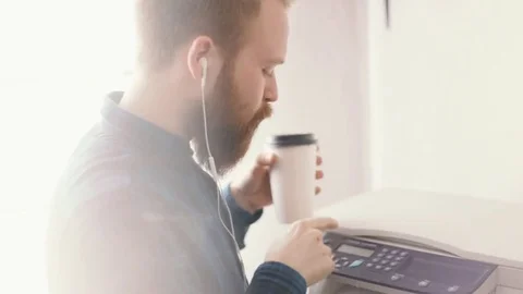Hipster drinking coffee at creative office and print Stock Footage 76491378