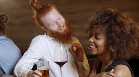 Hipster with a ginger beard flirts with a very beautiful black woman in a luxury Stock Footage 67289476