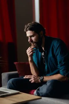 Hipster guy imagines something Stock Photos