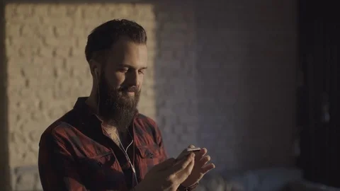 Hipster guy spending time with his mobile phone Stock Footage 72507529