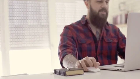 Hipster guy spending time with his laptop Stock Footage 72509756