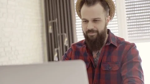 Hipster guy spending time with his laptop Stock Footage 72511218