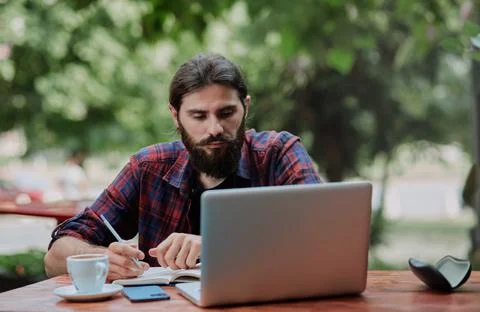 Hipster guy studyng in modern cafe Foto stock