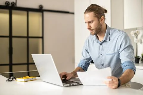 Hipster guy is using the laptop Foto stock