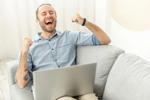 Hipster guy is using the laptop Stock Photos