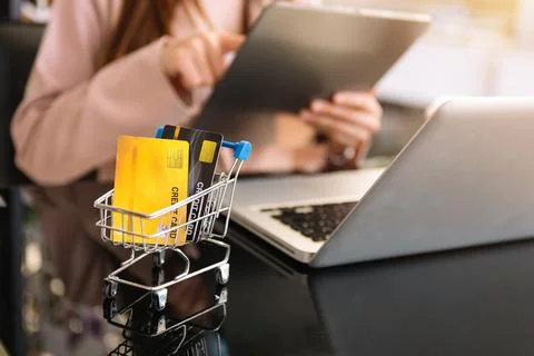 Hipster hand using laptop for mobile payments online Stock Photos