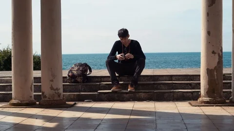 Hipster man cocking the shutter on vintage film dslr camera. Stock Footage 110730617