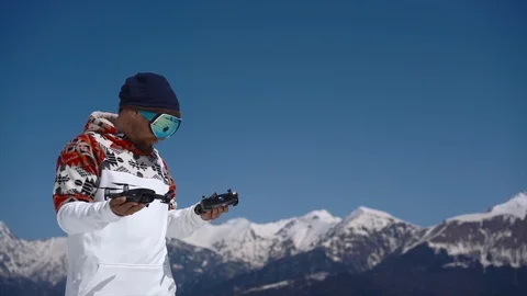 Hipster man with drone in mountains Stock Footage 88542677