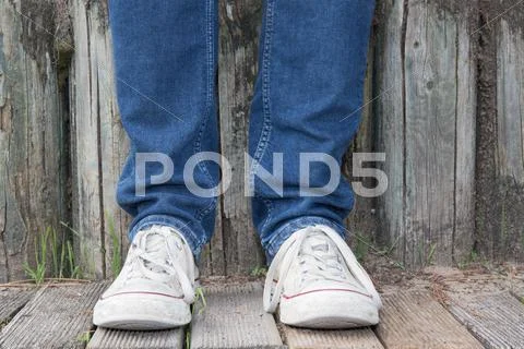 Hipster man with fashion shoes on wooden deck Stock Photos