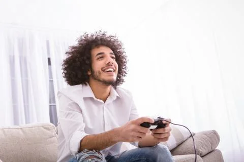 Hipster man playing computer games Stock Photos