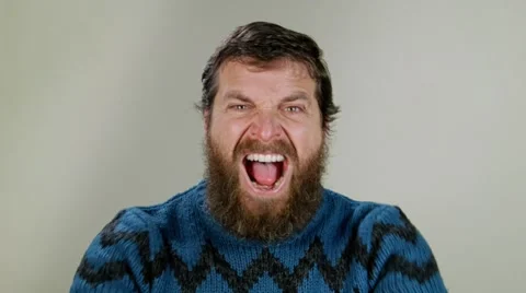 Hipster man screaming in studio on neutral background Video stock 58850706