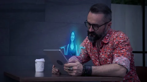 Hipster Man is using a holographic tablet, a woman dancing Stock Footage 148020659