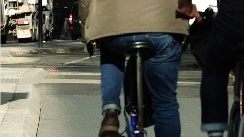 Hipster millennials cycle through the city of London on a bike lane. Stock Footage 101968231