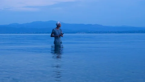 Hipster with notebook on sunset background. Freelancer working on the nature Stock-Footage 116915774