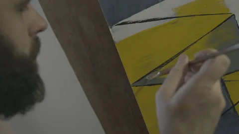 Hipster paints a picture in the workshop Stock Footage 141758079