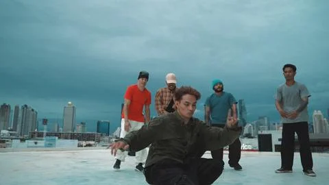 Hipster perform b-boy dance surround by multicultural dancer at city. Endeavor. Stock Photos