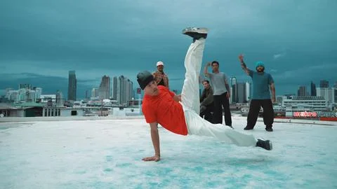Hipster perform b-boy dance surround by multicultural dancer at city. Endeavor. Stock Photos