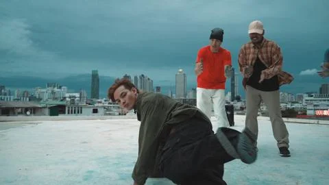 Hipster perform b-boy dance surround by multicultural dancer at city. Endeavor. Stock Photos