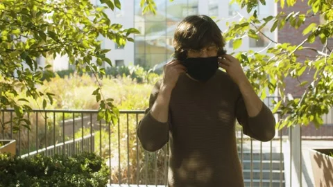 Hipster putting on protective mask Stock Footage 142446669