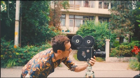 Hipster retro man using clapperboard and vintage 16mm old film camera Stock Footage 110924645