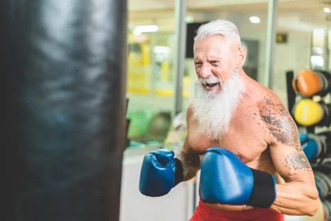 Hipster senior man boxing inside training fitness gym club - Mature fit boxer Stock Photos