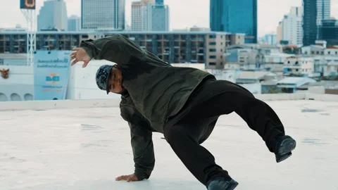 Hipster show break dancing at rooftop with sky scrapper or city sites. hiphop. Stock Footage 258183219