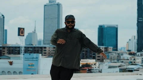 Hipster show break dancing at rooftop with sky scrapper or city sites. hiphop. Stock Footage 261928295