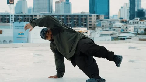 Hipster show break dancing at rooftop with sky scrapper or city sites. hiphop. Stock Footage 262642934