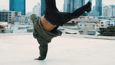 Hipster show break dancing at rooftop with sky scrapper or city sites. hiphop. Stock Footage 264736901