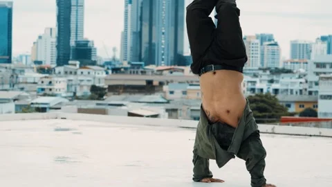 Hipster show break dancing at rooftop with sky scrapper or city sites. hiphop. Stock Footage 267769274