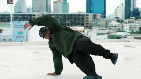 Hipster show break dancing at rooftop with sky scrapper or city sites. hiphop. Stock Footage 273512935