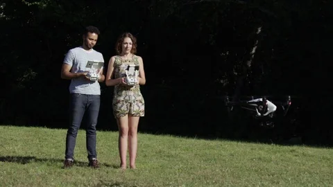 Hipster Tech Coders Flying A Drone In A Park Slow Motion Wide Angle Stock Footage 82591603