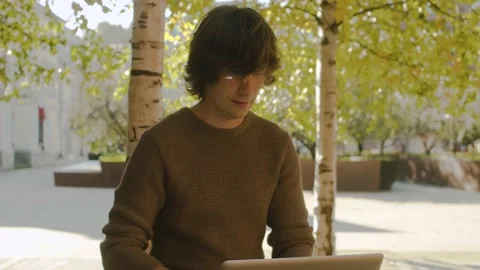 Hipster typing on laptop Stock Footage 142450776