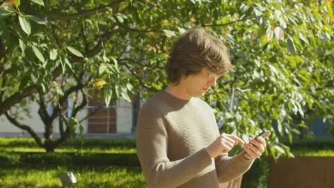 Hipster typing in smartphone Stock Footage 142442850