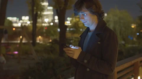 Hipster typing in smartphone Stock Footage 143585903