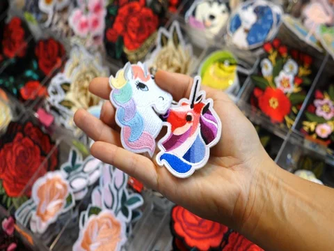 Hipster Unicorn Patch In Hand At Dry Goods Store Stock Footage 83224291