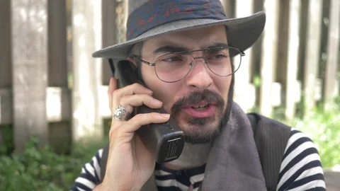 Hipster Using a 90s Phone To Make a Call Stock Footage 112042351