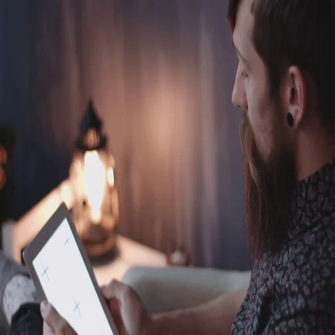 Hipster using digital tablet at New Year's Eve. Stock Footage 69289629