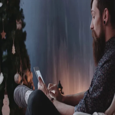 Hipster using digital tablet at New Year's ve. Stock Footage 69289891