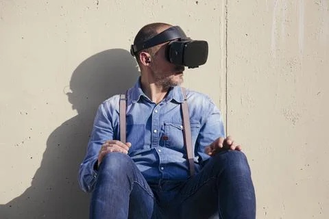 Hipster using Virtual Reality Glasses Stock Photos