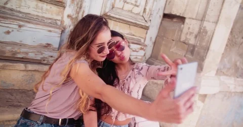 Hipster women taking selfies on vacations in old Italian town Stock Footage
