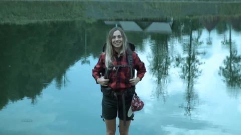Hipster young cute lady with backpack laughs and smile against the quit mirror Video stock 102281944