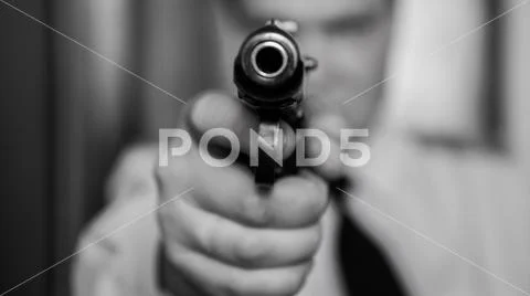 A hired assassin, a terrorist or a policeman in a black mask with a black combat Stock Photos