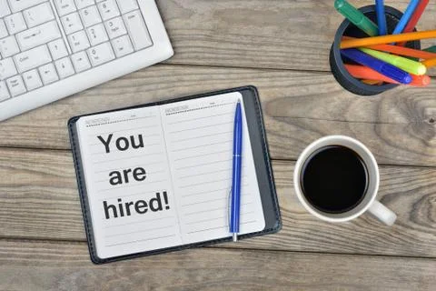 Hired message on notebook Photos