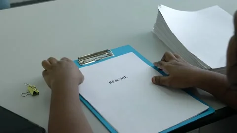 Hiring Manager going through a job applicant resume. Video stock 144312932
