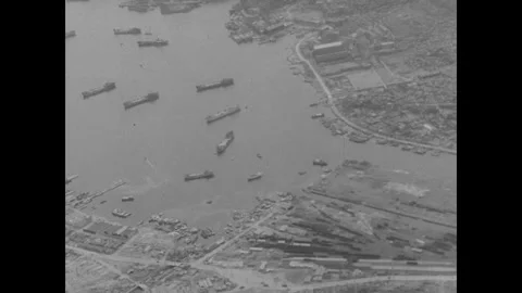 Hiroshima 1940s: Aerial view of a harbor with numerous cargo ships and vessels Stock Footage 341987683