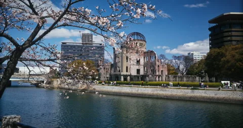 Hiroshima Peace Memorial Dome with Cherry Blossoms and River Stock Footage 344331240
