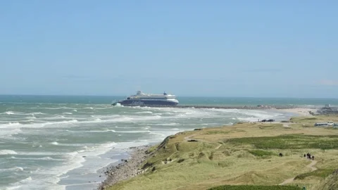 Hirthals, Denmark - July 06, 2026: Ferry entering  harbor on a windy day Video stock 338329096